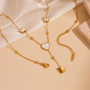 Layered gold stainless steel necklace with shell butterfly and heart pendants