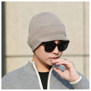 Detailed knit texture of light khaki winter beanie for warm outdoor thermal protection