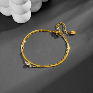 Double-layered gold titanium steel bracelet featuring a round white zircon and sequin chain