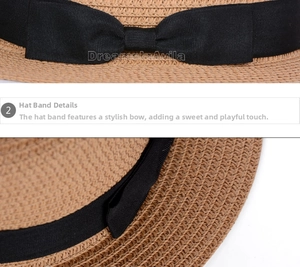 Detail view of woven straw hat featuring black ribbon bow and interior sweatband stitching