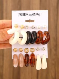Set of 12 pairs geometric resin C-hoop earrings in gold, black and marble finish