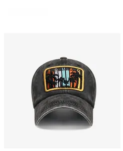 Macro view of vintage washed cotton baseball cap with embroidered palm tree patch