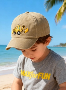 Close-up of yellow excavator embroidery on a khaki twill cotton baseball cap for kids