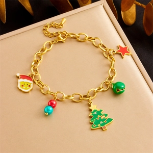 Golden Christmas charm bracelet with tree, Santa, bell, and star pendants for women