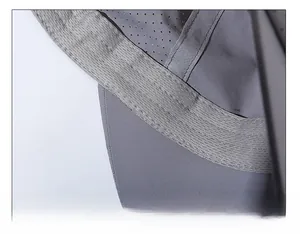 Detail of widened sweatband and breathable mesh fabric with fine stitching on grey sports cap