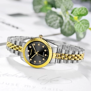 Detail of YOLAKO two-tone gold and silver quartz watch with diamond markers and black dial