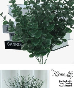 Close-up of lifelike faux eucalyptus leaves with natural frosted finish for home decor