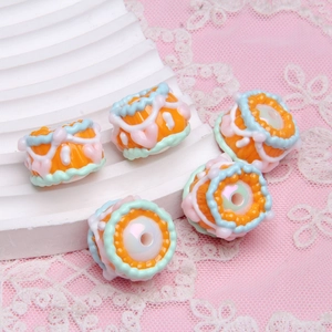 Macro shot of colorful hand-painted oil beads for DIY jewelry and beaded pens