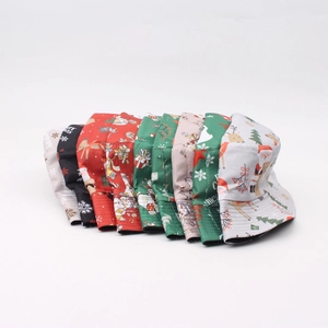 Christmas reversible fisherman bucket hats with festive Santa and reindeer prints