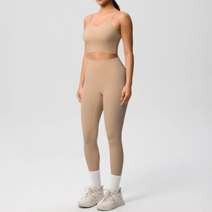 Nude yoga set featuring slim strap sports bra and high waisted leggings in matte finish