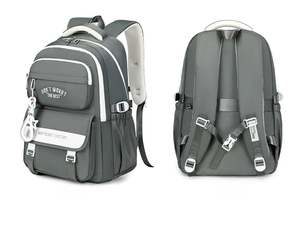 Detail of grey student backpack featuring breathable padded straps and side pockets