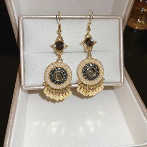 Bohemian pearl drop earrings with gold leaf tassels and brown gemstone in vintage style