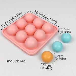 Pink 9-cavity silicone mold showing detailed dimensions for spherical ice and candy