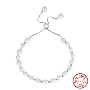 Detailed view of adjustable 925 sterling silver chain and baroque freshwater pearls