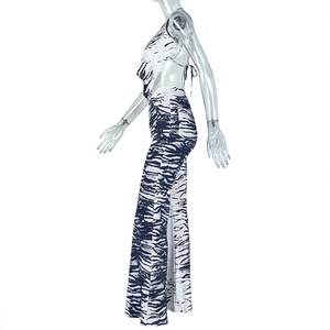 Detail view of backless halter top and wide-leg trousers in black and white zebra print
