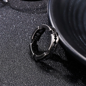 Detailed view of industrial style razor blade edge stainless steel ring for men in dark grey
