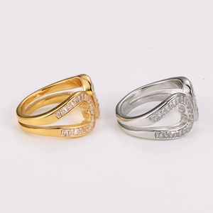 Macro detail of open-end rings featuring hollow heart design with pavé crystals