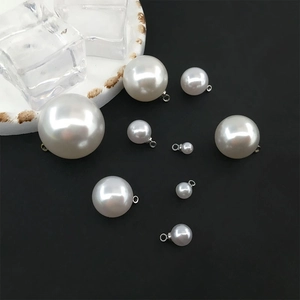 Polished white teardrop and round faux pearl charms with silver metal pendant caps