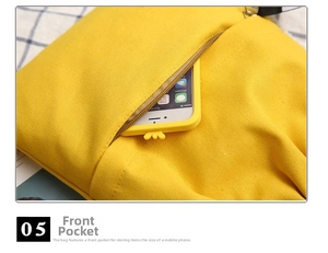 Detail of canvas drawstring bag with front zipper pocket holding a yellow smartphone