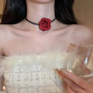 Detail of a dark red handmade fabric rose choker with black double-layer thin cords