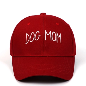 Red cotton baseball cap with white DOG MOM embroidery in a classic six-panel design