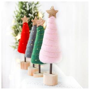 Pink wool felt Christmas tree with gold star and wire detail on a wooden base