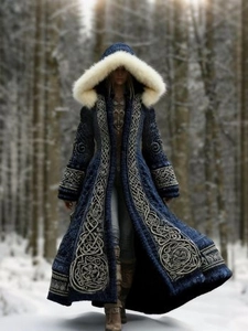 Close-up of vintage dark blue hooded cloak with white faux fur trim and embroidery