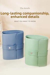 Detail of portable leather jewelry roll with snap closure and multi-layer storage
