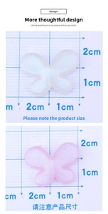 Macro detail of 2cm glitter resin butterfly charms with iridescent finish and ruler scale