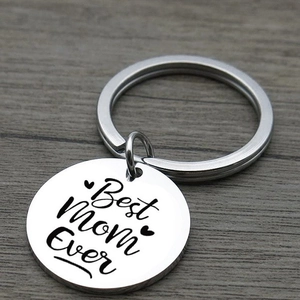 Polished stainless steel keychain with Best Mom Ever engraving on a wooden surface