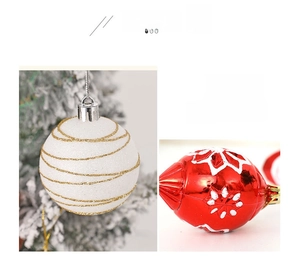 Detailed view of red Christmas ornaments with white snowflakes and gold glitter texture