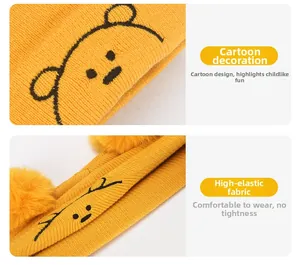 Détails du bonnet tricoté jaune pour bébé avec broderie cartoon et deux pompons doux