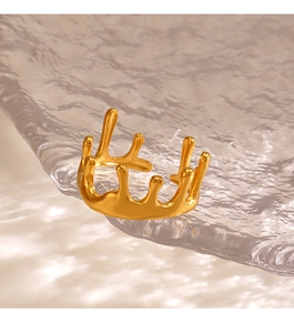 Macro shot of 18K gold plated lava ring detail on textured glass with soft lighting