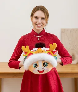 Close-up of Asian model holding a festive red mascot plush dragon hand warmer toy