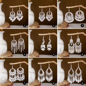 Ethnic silver-style earrings set featuring peacock and tassel designs in a 9-grid display