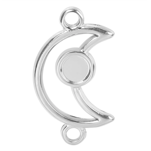 Macro view of silver crescent moon jewelry connector with round tray and rings