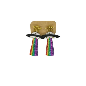 Detailed view of UFO acrylic earrings with rainbow beams and sparkling gold stars