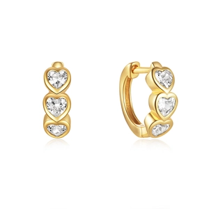 Macro view of gold plated heart earrings with three sparkling heart-shaped zircons