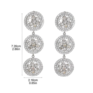 Detail view of rhinestone drop earrings with 7.26cm length and 2.16cm width size labels