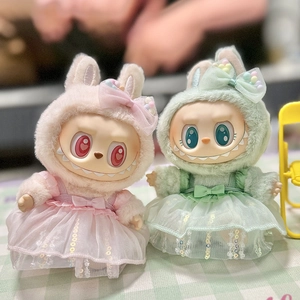 Close-up of pink and green plush hoodies with tulle skirts for Labubu doll accessories