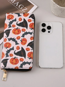 Halloween PU leather long wallet with orange pumpkin prints and zipper next to a smartphone