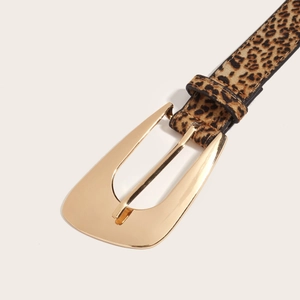 Women's leopard print belt with a polished gold horseshoe buckle on a white background