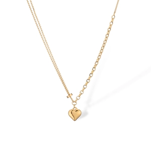 Detail of gold-plated asymmetric chain necklace with a 3D heart pendant on white background