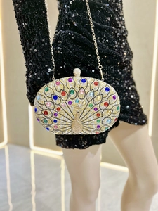 Detailed peacock evening clutch bag with sparkling rhinestones and metal chain strap