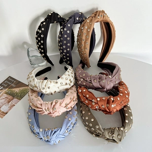 Knotted satin headbands with rhinestones and studs in various colors for women