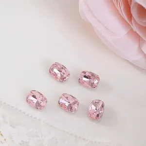 Macro view of 6x8mm pink cushion-cut rhinestone crystals for luxury nail art decoration