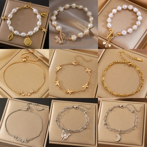 Various elegant stainless steel bracelets with pearls, bows, and butterflies for women