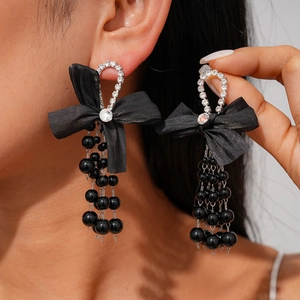 Elegant black chiffon bow earrings with long pearl tassels and sparkling rhinestone accents