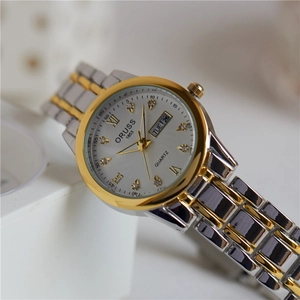 Elegant silver and gold quartz watch for women with luxury rhinestone dial and day-date feature