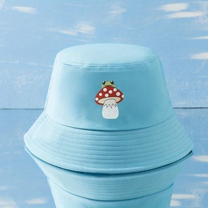 Light blue bucket hat featuring a cute cartoon frog and mushroom embroidery for summer
